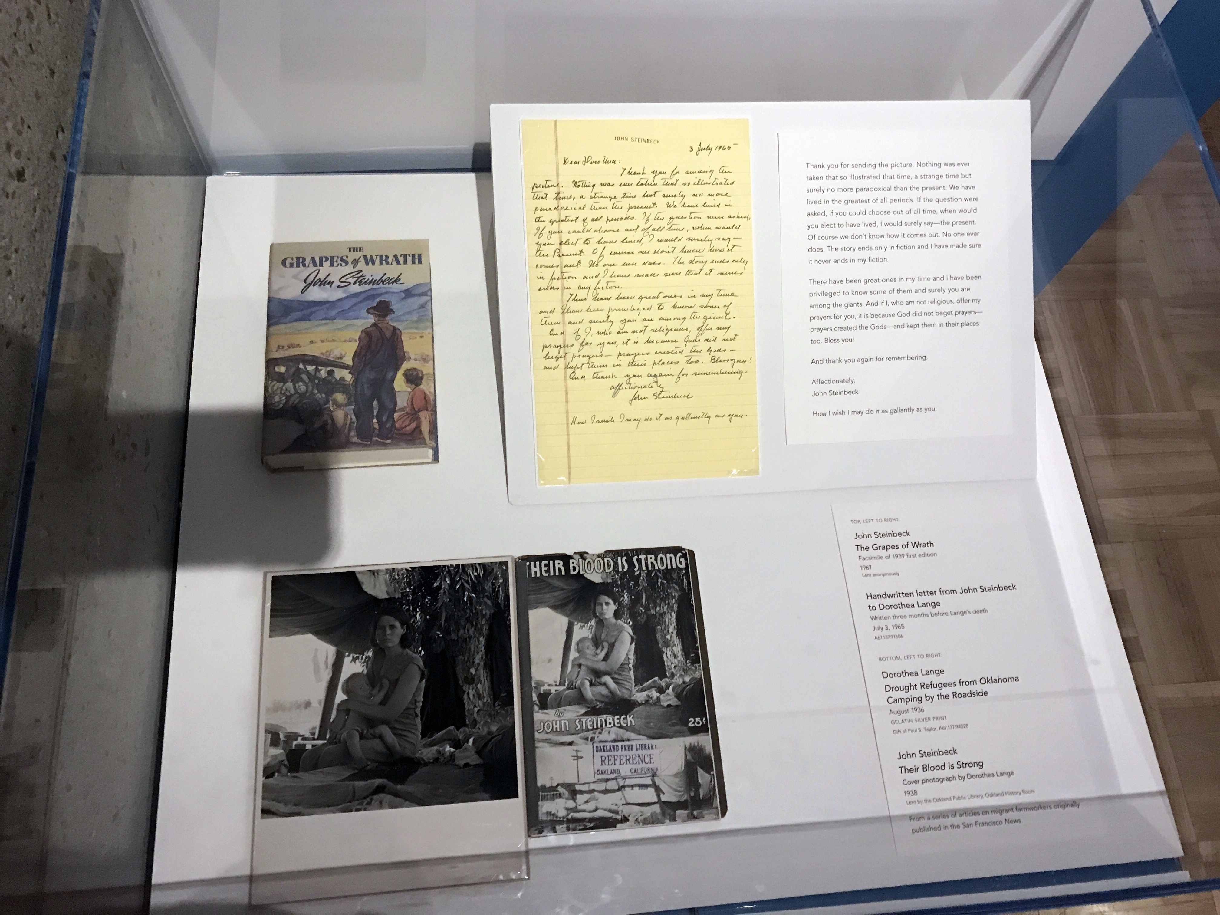 A display featuring a letter written to photographer Dorothea Lange by author John Steinbeck in 1965. Displayed in the Oakland Museum of California.